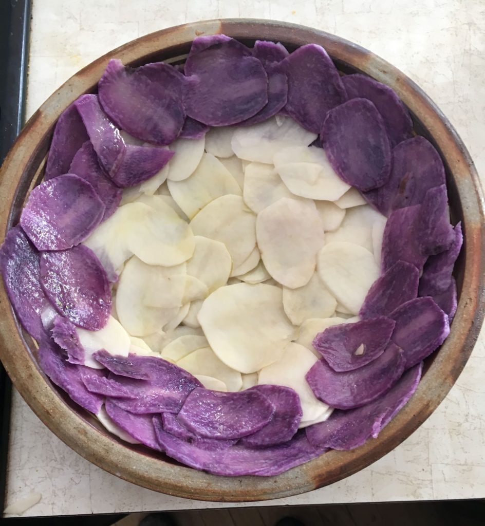 Sliced purple and white potatoes for quiche crust